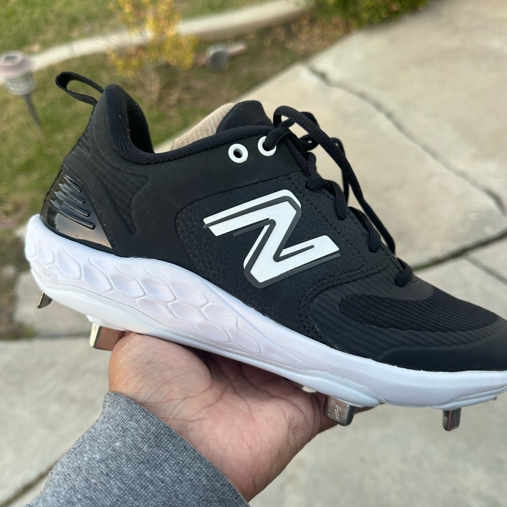 New Balance metal cleats size 7 1/2 and 8